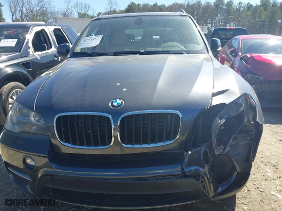 2011 BMW X5 35i with VIN 5UXZV4C51BL740731, listed as a IAAI auction lot 41771257 with 148,638 mi miles. Bid and sale history available at carsss.com. Image 12.
