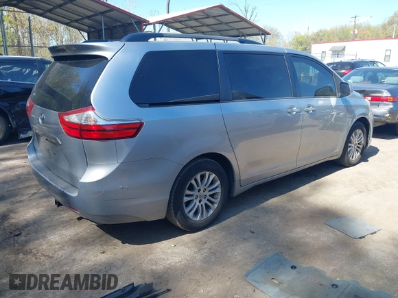 2015 Toyota Sienna XLE with VIN 5TDYK3DC0FS558486, listed as a IAAI auction lot 42064281 with 211,119 mi miles and . Bid and sale history available at DreamBid. Image 4.