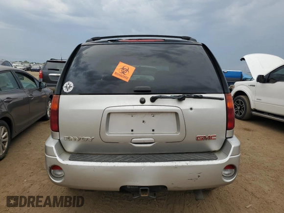 2005 GMC Envoy SLT with VIN 1GKDT13S152124404, listed as a Copart auction lot 64011494 with 212,951 mi miles and Salvage Title. Bid and sale history available at DreamBid. Image 6.