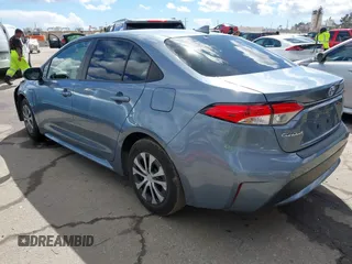 2021 Toyota Corolla Hybrid LE with VIN JTDEAMDE0MJ026601, listed as a IAAI auction lot 41797452 with 85,294 mi miles. Bid and sale history available at carsss.com. Image 3.