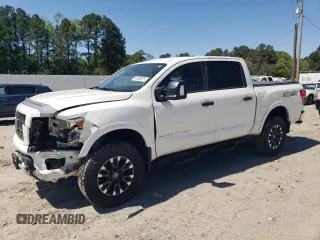 2018 Nissan Titan S with VIN 1N6AA1E50JN523001, listed as a Copart auction lot 54908025 with 61,576 mi miles and Salvage title. Bid and sale history available at DreamBid. Image 1.
