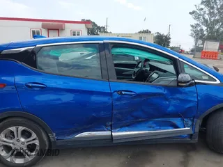 2019 Chevrolet Bolt EV LT z VIN 1G1FY6S02K4135178, wystawiony jako IAAI lot #42419494 z przebiegiem 60 115 mil mil oraz . Historia ofert i sprzedaży dostępna na DreamBid. Obrazek 13.