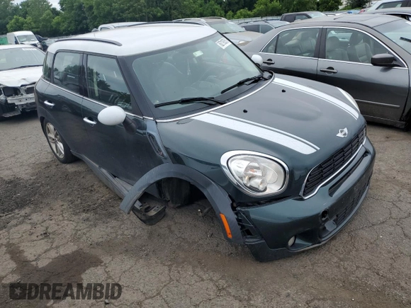 2014 MINI Countryman S with VIN WMWZC5C58EWP39797, listed as a Copart auction lot 62193515 with 84,989 mi miles and Salvage title. Bid and sale history available at DreamBid. Image 4.