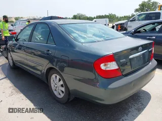 2002 Toyota Camry LE z VIN 4T1BE30KX2U591037, wystawiony jako IAAI lot #42077641 z przebiegiem 86 569 mil mil oraz . Historia ofert i sprzedaży dostępna na DreamBid. Obrazek 3.