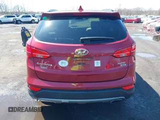 2014 Hyundai Santa Fe z VIN 5XYZUDLB3EG226857, wystawiony jako IAAI lot #41917762 z przebiegiem 42 677 mil mil oraz . Historia ofert i sprzedaży dostępna na DreamBid. Obrazek 16.