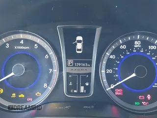 2013 Hyundai Azera z VIN KMHFH4JG3DA230844, wystawiony jako IAAI lot #41817997 z przebiegiem 129 163 mil mil oraz . Historia ofert i sprzedaży dostępna na DreamBid. Obrazek 16.
