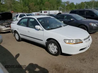 2000 Honda Accord LX z VIN 1HGCG1642YA080255, wystawiony jako Copart lot #53636855 z przebiegiem 146 478 mil mil oraz Szkoda całkowita • Salvage title. Historia ofert i sprzedaży dostępna na DreamBid. Obrazek 4.