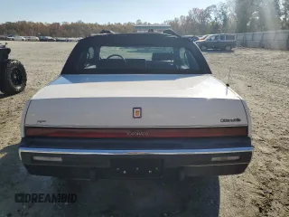 1987 Oldsmobile Toronado with VIN 1G3EZ1130HU307201, listed as a Copart auction lot 78028584 with 104,837 mi miles and Salvage Title. Bid and sale history available at DreamBid. Image 6.