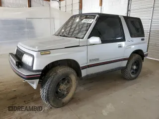 1990 Geo Tracker z VIN 2CNBJ18UXL6218795, wystawiony jako Copart lot #53083615 z przebiegiem 83 413 mil mil oraz Szkody całkowita. Historia ofert i sprzedaży dostępna na DreamBid. Obrazek 1.