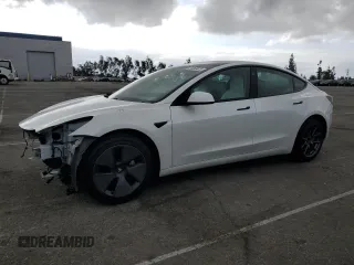 2021 Tesla Model 3 Standard Range Plus with VIN 5YJ3E1EA6MF066064, listed as a Copart auction lot 54063625 with 27,424 mi miles and Salvage Title. Bid and sale history available at DreamBid. Image 1.