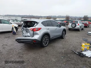 2016 Mazda CX-5 Grand Touring with VIN JM3KE4DY4G0712465, listed as a IAAI auction lot 41859217 with 61,806 mi miles and . Bid and sale history available at carsss.com. Image 4.