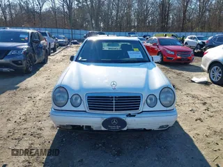 1999 Mercedes-Benz E-Class with VIN WDBJF82H0XX015778, listed as a IAAI auction lot 41269886 with 184,011 mi miles. Bid and sale history available at carsss.com. Image 12.