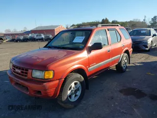1999 Isuzu Rodeo S with VIN 4S2CM58W6X4336332, listed as a IAAI auction lot 41758338 with 183,983 mi miles. Bid and sale history available at carsss.com. Image 2.