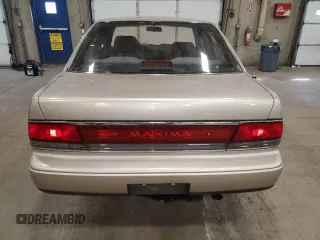 1990 Nissan Maxima z VIN JN1HJ01PXLT401797, wystawiony jako Copart lot #47868945 z przebiegiem Nie podano mil oraz Szkody całkowita. Historia ofert i sprzedaży dostępna na DreamBid. Obrazek 6.