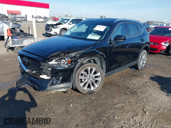 2020 Mazda CX-5 Grand Touring with VIN JM3KFBDM0L0790508, listed as a IAAI auction lot 41883319 with 114,398 mi miles and . Bid and sale history available at carsss.com. Image 2.