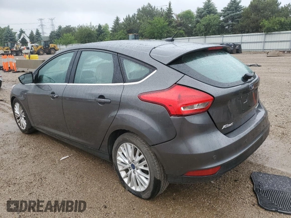 2018 Ford Focus Titanium z VIN 1FADP3N21JL295883, wystawiony jako Copart lot #59051015 z przebiegiem 43 284 mil mil oraz Szkoda całkowita • Salvage title. Historia ofert i sprzedaży dostępna na DreamBid. Obrazek 2.