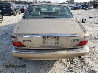 1998 Jaguar XJ with VIN SAJHX1242WC845736, listed as a Copart auction lot 82006044 with 188,785 mi miles and Salvage title. Bid and sale history available at DreamBid. Image 6.