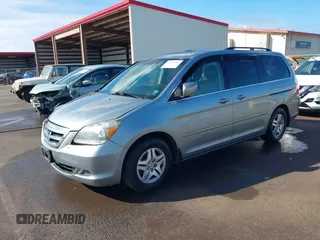 2007 Honda Odyssey EX-L with VIN 5FNRL38677B021464, listed as a IAAI auction lot 41568582 with 131,359 mi miles and . Bid and sale history available at DreamBid. Image 2.