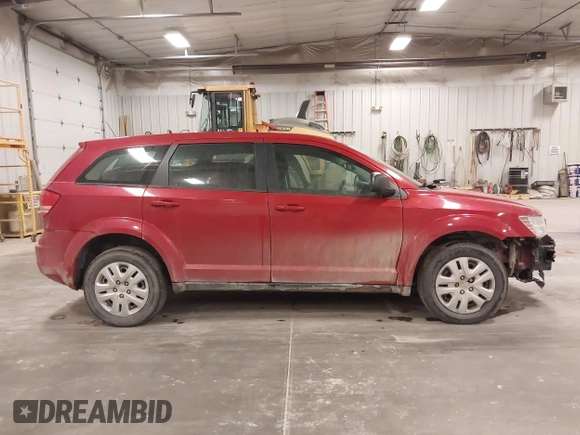 2015 Dodge Journey American Value z VIN 3C4PDCAB5FT720300, wystawiony jako IAAI lot #42074690 z przebiegiem 144 690 mil mil oraz . Historia ofert i sprzedaży dostępna na DreamBid. Obrazek 13.