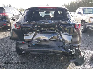 2021 Mazda CX-30 Premium with VIN 3MVDMBDY2MM239231, listed as a IAAI auction lot 41655159 with 22,679 mi miles and . Bid and sale history available at carsss.com. Image 17.