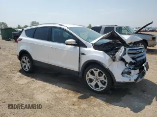 2019 Ford Escape Titanium z VIN 1FMCU9J93KUA51020, wystawiony jako Copart lot #60462495 z przebiegiem 59 998 mil mil oraz Szkoda całkowita • Salvage title. Historia ofert i sprzedaży dostępna na DreamBid. Obrazek 4.
