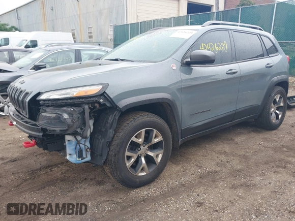 2014 Jeep Cherokee Trailhawk with VIN 1C4PJMBB5EW156315, listed as a IAAI auction lot 42426229 with 154,019 mi miles and . Bid and sale history available at DreamBid. Image 2.