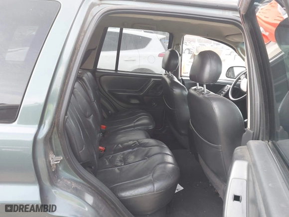 2003 Jeep Grand Cherokee Laredo with VIN 1J4GW48S93C583644, listed as a IAAI auction lot 41656314 with 256,653 mi miles. Bid and sale history available at carsss.com. Image 8.