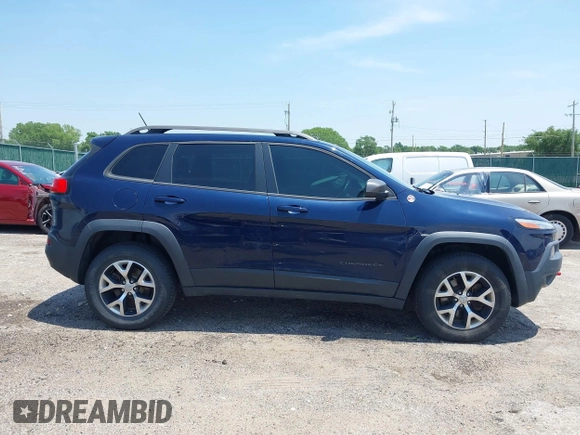 2015 Jeep Cherokee Trailhawk with VIN 1C4PJMBS3FW704622, listed as a IAAI auction lot 42465702 with 96,831 mi miles and . Bid and sale history available at DreamBid. Image 13.