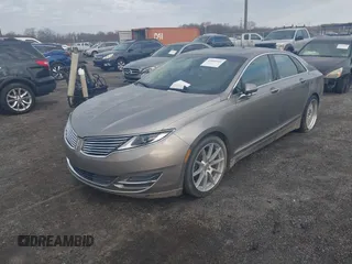 2015 Lincoln MKZ z VIN 3LN6L2J98FR620089, wystawiony jako IAAI lot #41805555 z przebiegiem Nie podano mil oraz . Historia ofert i sprzedaży dostępna na DreamBid. Obrazek 2.