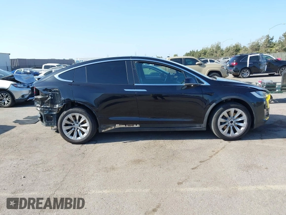 2017 Tesla Model X 90D with VIN 5YJXCBE25HF044617, listed as a IAAI auction lot 42096323 with 115,077 mi miles and . Bid and sale history available at DreamBid. Image 14.