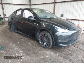 2023 Tesla Model Y Performance with VIN 7SAYGDEF2PF800641, listed as a IAAI auction lot 41612596 with 60,984 mi miles and . Bid and sale history available at DreamBid. Image 1.