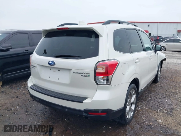 2017 Subaru Forester Touring with VIN JF2SJAWCXHH501702, listed as a IAAI auction lot 42080564 with 188,392 mi miles and . Bid and sale history available at DreamBid. Image 4.