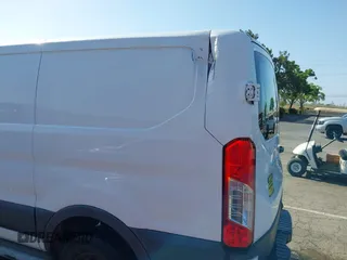 2016 Ford Transit Cargo with VIN 1FTYR1ZM8GKB42857, listed as a IAAI auction lot 42200699 with 195,563 mi miles. Bid and sale history available at carsss.com. Image 6.