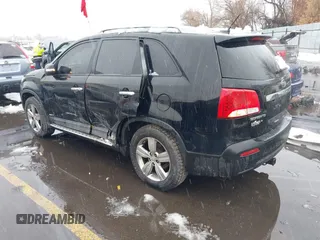 2012 Kia Sorento EX with VIN 5XYKUDA2XCG301636, listed as a IAAI auction lot 41619793 with 220,692 mi miles. Bid and sale history available at carsss.com. Image 3.