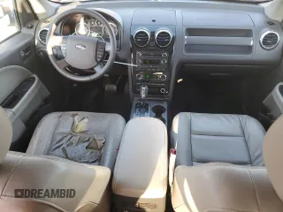 2008 Ford Taurus X SEL with VIN 1FMDK02W68GA27117, listed as a Copart auction lot 52310685 with 178,529 mi miles and Salvage Title. Bid and sale history available at DreamBid. Image 8.