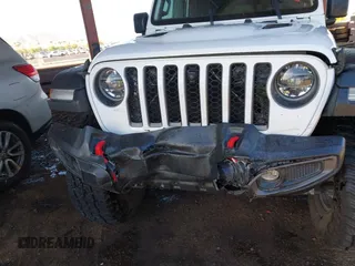 2022 Jeep Gladiator Rubicon with VIN 1C6JJTBM6NL145009, listed as a IAAI auction lot 42134143 with 59,438 mi miles and . Bid and sale history available at DreamBid. Image 6.