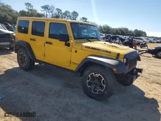 2015 Jeep Wrangler Unlimited Rubicon Hard Rock with VIN 1C4HJWFG4FL648732, listed as a Copart auction lot 88690435 with 196,650 mi miles and Salvage Title. Bid and sale history available at carsss.com. Image 4.