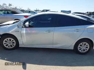 2021 Toyota Prius L Eco with VIN JTDKAMFU8M3135142, listed as a IAAI auction lot 42317007 with 77,353 mi miles and . Bid and sale history available at DreamBid. Image 14.