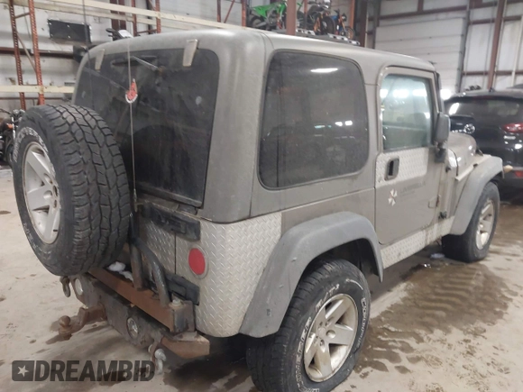 2005 Jeep Wrangler Rubicon with VIN 1J4FA69S65P311732, listed as a IAAI auction lot 41442147 with 174,277 mi miles. Bid and sale history available at carsss.com. Image 4.