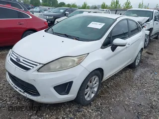 2012 Ford Fiesta SE with VIN 3FADP4BJ0CM220742, listed as a IAAI auction lot 42207303 with 175,875 mi miles and . Bid and sale history available at DreamBid. Image 2.