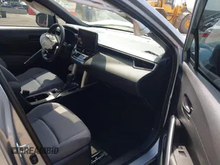 2023 Toyota Corolla Cross Hybrid S with VIN 7MUFBABG1PV014992, listed as a IAAI auction lot 42202656 with 18,913 mi miles and . Bid and sale history available at DreamBid. Image 5.