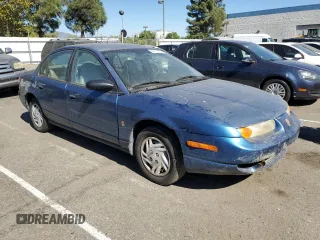 2001 Saturn SL z VIN 1G8ZF52861Z275529, wystawiony jako Copart lot #74153154 z przebiegiem 171 272 mil mil oraz Tytuł czysty. Historia ofert i sprzedaży dostępna na DreamBid. Obrazek 4.