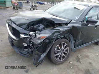 2018 Mazda CX-5 Grand Touring with VIN JM3KFBDM1J0358197, listed as a IAAI auction lot 41967940 with 148,119 mi miles and . Bid and sale history available at DreamBid. Image 6.