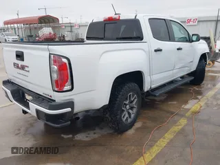 2021 GMC Canyon 4WD AT4 w/Leather with VIN 1GTG6FEN6M1154040, listed as a IAAI auction lot 41209527 with 29,484 mi miles. Bid and sale history available at carsss.com. Image 4.