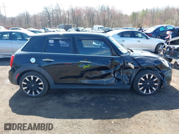 2017 MINI Hardtop 4 Door Cooper S z VIN WMWXU3C39H2F48699, wystawiony jako IAAI lot #41924423 z przebiegiem 81 249 mil mil oraz . Historia ofert i sprzedaży dostępna na DreamBid. Obrazek 13.