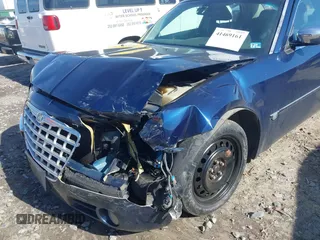 2005 Chrysler 300 with VIN 2C3JA63HX5H654114, listed as a IAAI auction lot 41469161 with 136,104 mi miles. Bid and sale history available at carsss.com. Image 6.