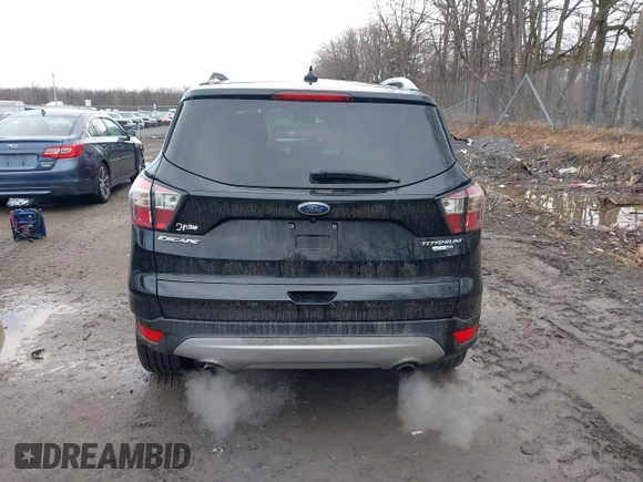 2018 Ford Escape Titanium с VIN 1FMCU9J99JUA14598, выставлен на аукционе IAAI как лот 41859368 с пробегом 59 438 миль миль и . История ставок и продаж доступна на DreamBid. Изображение 16.