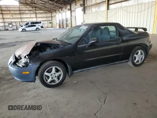 1997 Honda del Sol Si with VIN JHMEH6265VS005885, listed as a Copart auction lot 43037075 with 86,665 mi miles and Salvage Title. Bid and sale history available at carsss.com. Image 1.