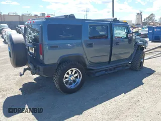 2005 Hummer H2 SUV with VIN 5GRGN23U35H105620, listed as a IAAI auction lot 41912574 with 232,938 mi miles. Bid and sale history available at carsss.com. Image 4.