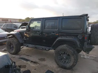 2013 Jeep Wrangler Unlimited Rubicon with VIN 1C4BJWFG2DL531203, listed as a IAAI auction lot 40729064 with 84,296 mi miles. Bid and sale history available at carsss.com. Image 14.